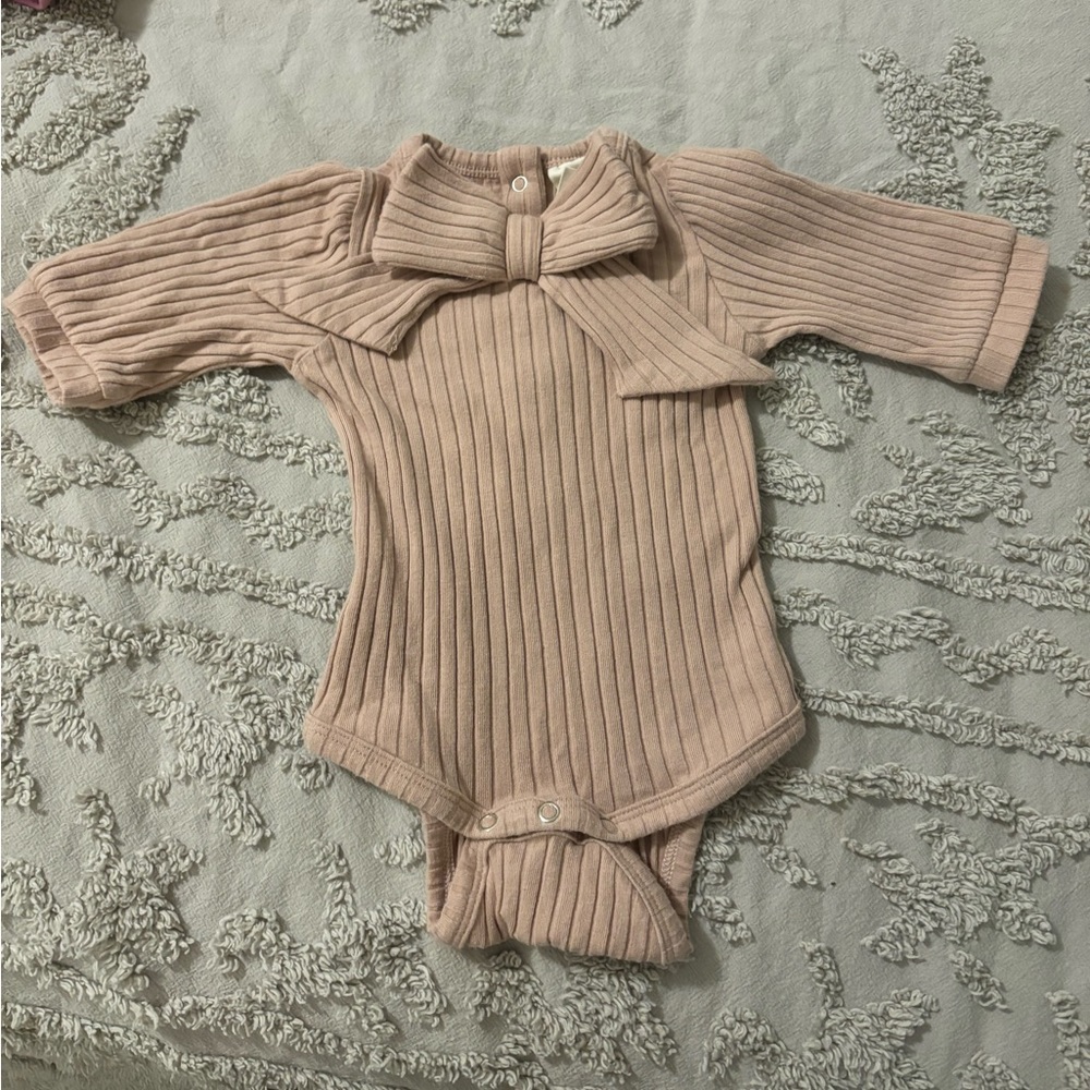 Kate Quinn soft pink organic cotton wide rib bow front bodysuit onesie